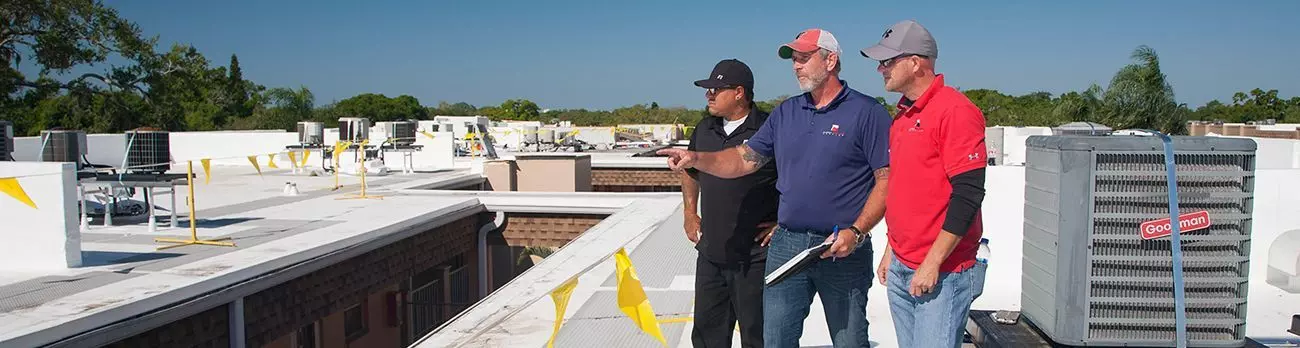 Florida Southern Roofing employees on site during a commercial roof repair. Commercial roof replacement services in Sarasota, FL Florida Southern Roofing And SheetMetal